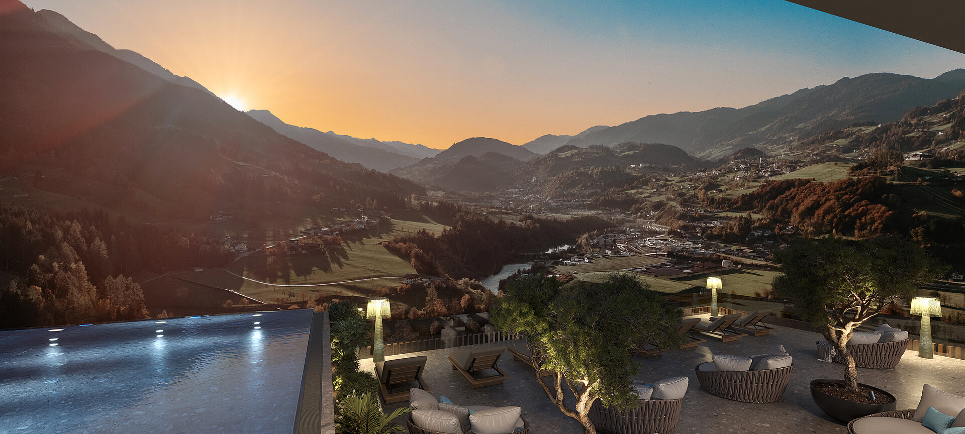 Ausblick vom Infinitypool in die Berge mit Sonnenuntergang.